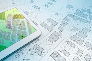 Buildings Permit concept with imaginary cadastral on digital tablet - building activity and construction industry with General Urban Plan